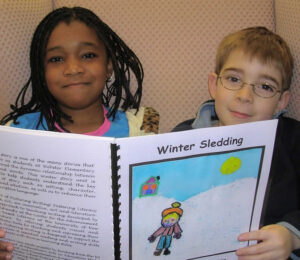 Picturing Writing first grade boy and girl reading published book